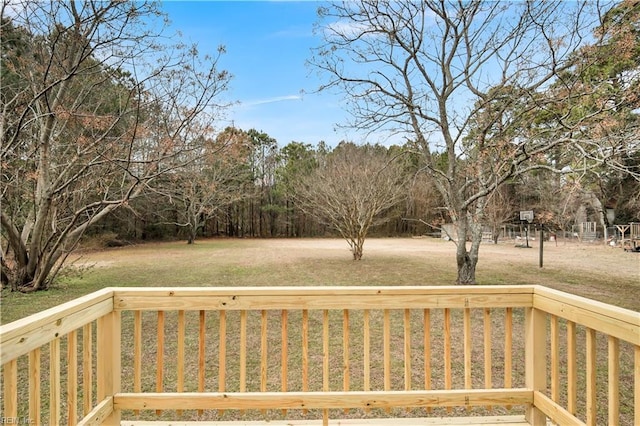 wooden terrace with a yard