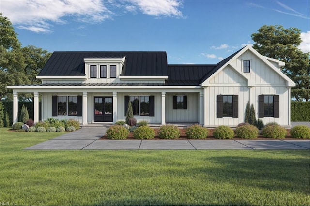 view of front of home featuring covered porch, board and batten siding, a front yard, a standing seam roof, and metal roof