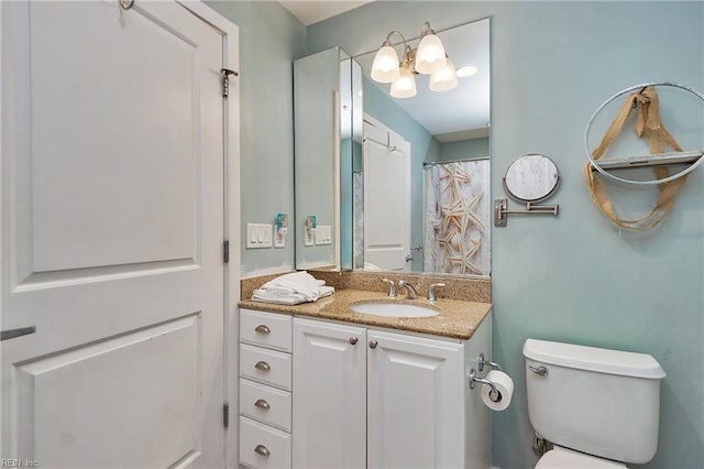 full bathroom with vanity and toilet