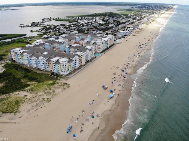 birds eye view of property featuring a city view, a water view, and a beach view