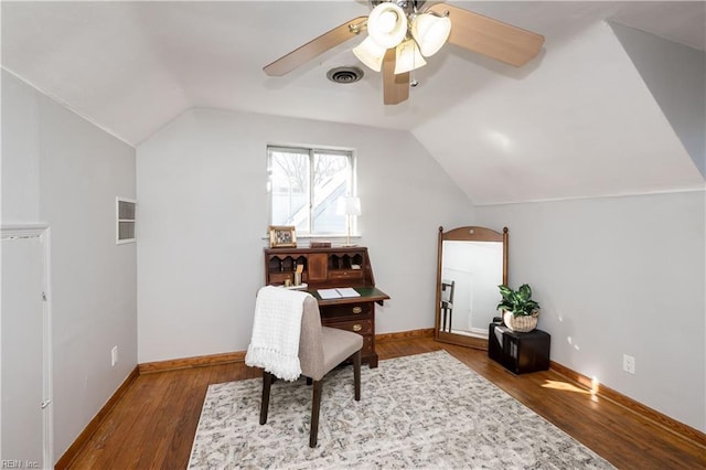 office area with visible vents, vaulted ceiling, baseboards, and wood finished floors