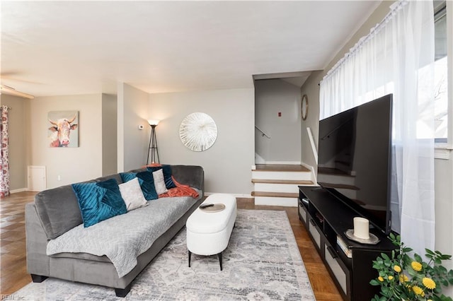 living area with stairway and a wealth of natural light