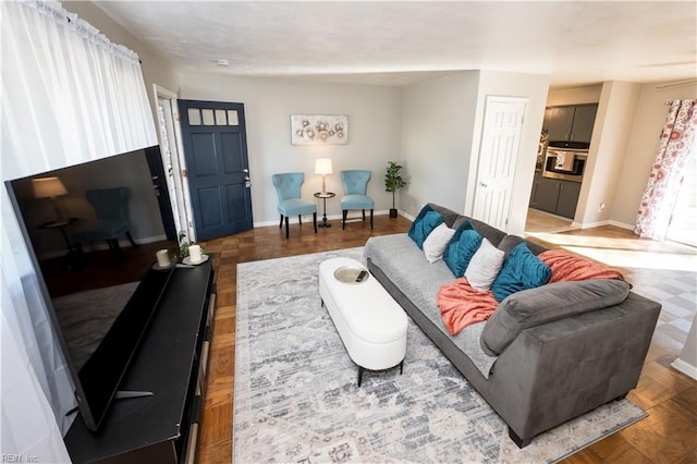 living room featuring baseboards