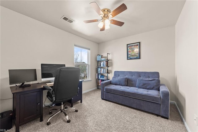 office space featuring ceiling fan, carpet flooring, visible vents, and baseboards