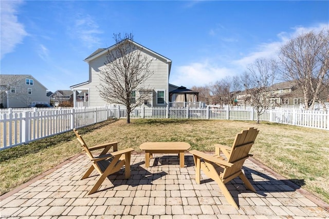 view of patio featuring a residential view and a fenced backyard