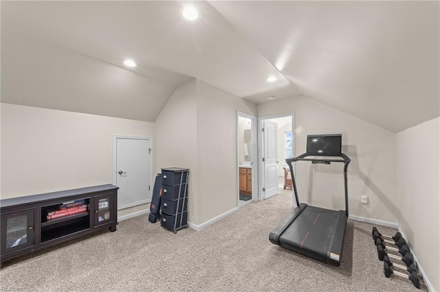 exercise area featuring carpet, baseboards, vaulted ceiling, and recessed lighting