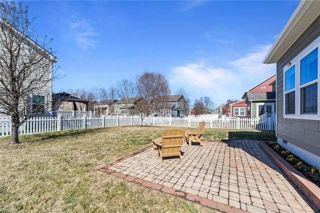 view of yard featuring a gazebo, a patio area, a fenced backyard, and a residential view