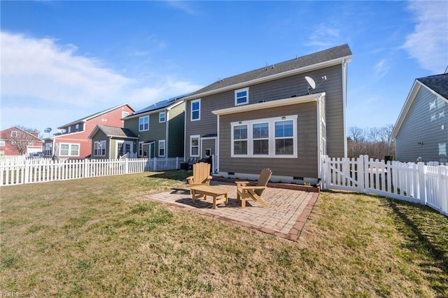 back of property featuring a patio, a fenced backyard, a lawn, crawl space, and a residential view