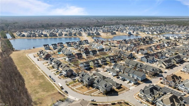 bird's eye view featuring a water view and a residential view