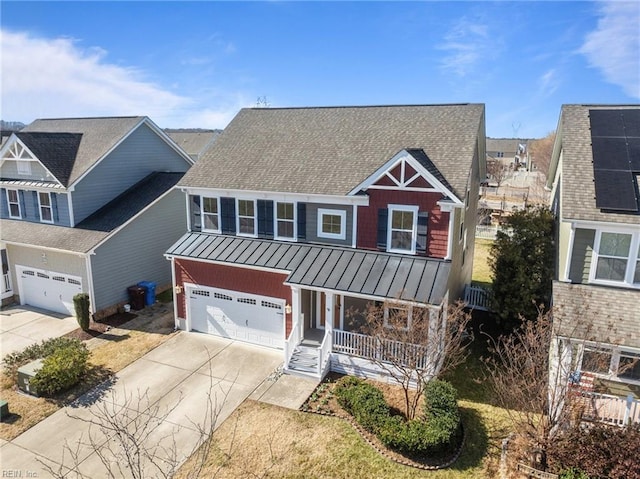 view of front of home featuring roof with shingles, a porch, a standing seam roof, metal roof, and driveway