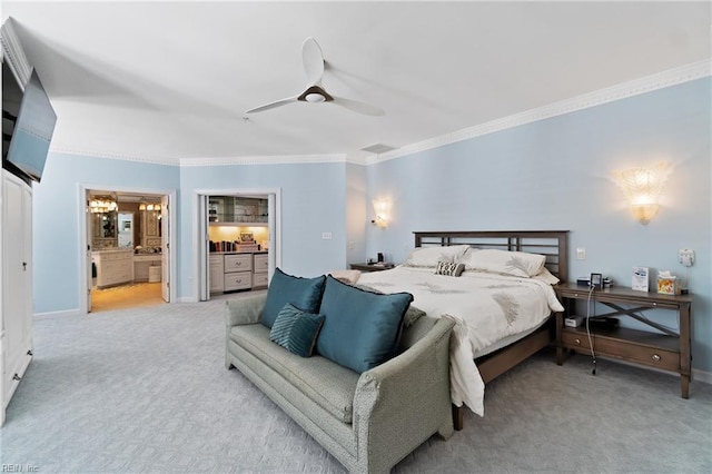 bedroom featuring light carpet, baseboards, ceiling fan, ornamental molding, and ensuite bathroom