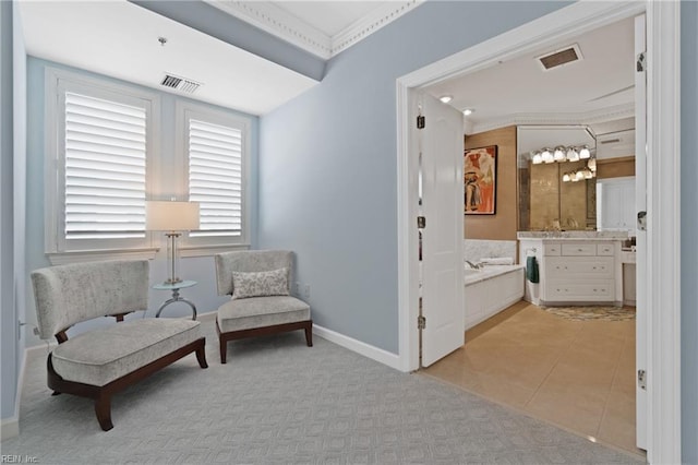 living area featuring baseboards, visible vents, and light tile patterned flooring