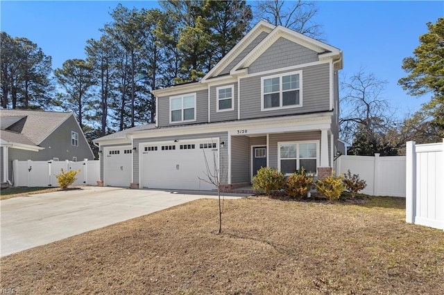 craftsman inspired home with an attached garage, fence, a front lawn, and concrete driveway