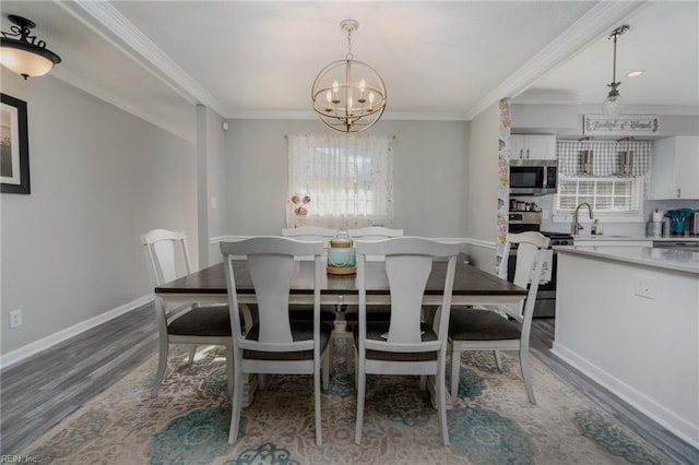 dining space featuring a notable chandelier, baseboards, dark wood-style flooring, and crown molding