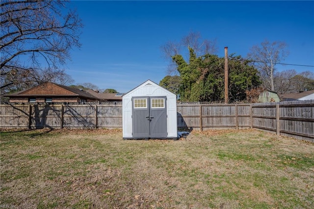 view of shed with a fenced backyard