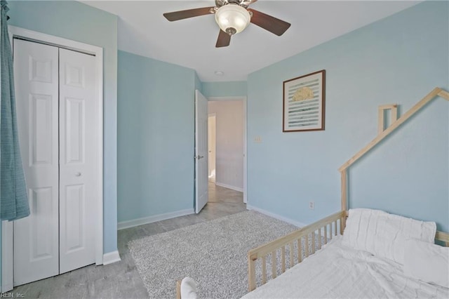 bedroom featuring a closet, a ceiling fan, and baseboards