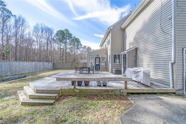 wooden deck featuring outdoor dining space, a grill, and fence