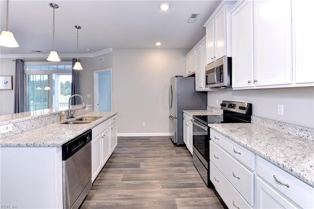 kitchen with visible vents, white cabinets, hanging light fixtures, stainless steel appliances, and a sink