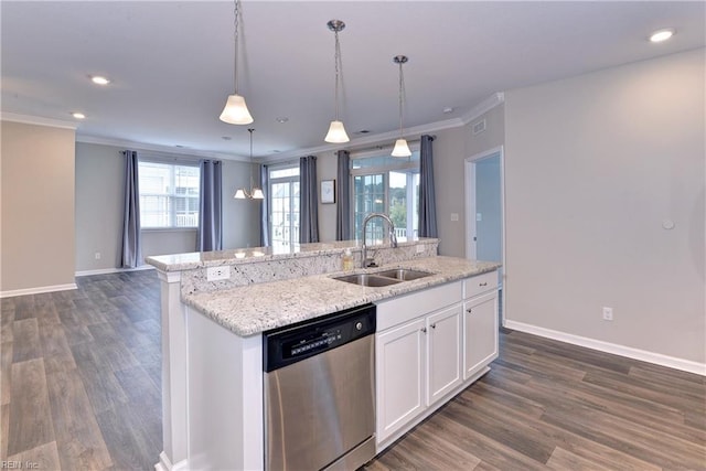 kitchen featuring decorative light fixtures, white cabinets, a sink, an island with sink, and dishwasher