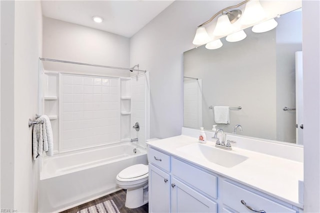 bathroom featuring  shower combination, wood finished floors, vanity, and toilet