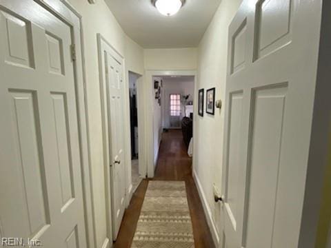 hall with dark wood finished floors