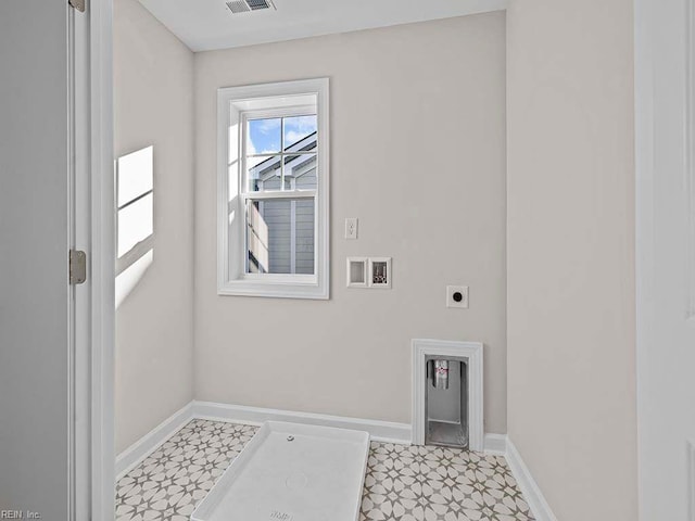 washroom with hookup for a washing machine, visible vents, electric dryer hookup, laundry area, and baseboards