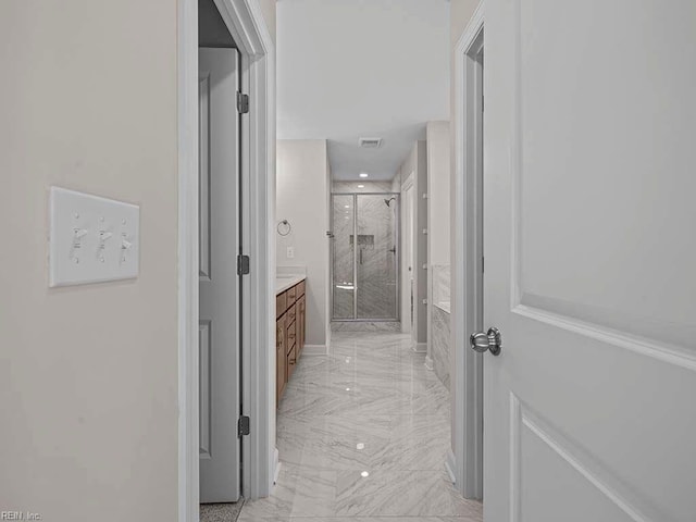 hallway with marble finish floor and visible vents