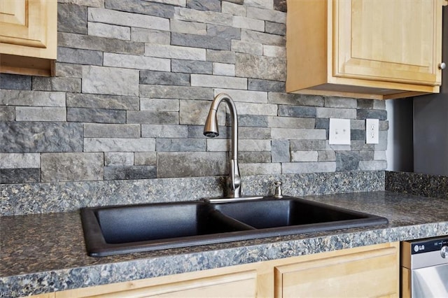 details featuring light brown cabinets, a sink, decorative backsplash, dishwasher, and dark countertops