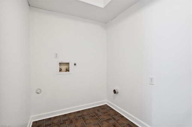 laundry room featuring laundry area, baseboards, washer hookup, and electric dryer hookup