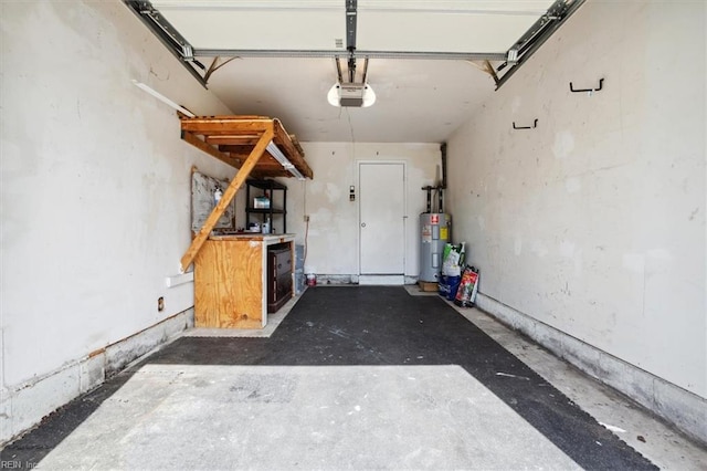 garage featuring water heater and a garage door opener