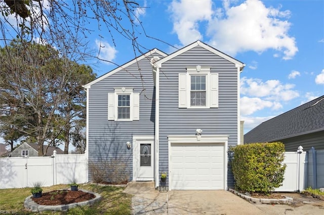 traditional home featuring a garage, concrete driveway, and fence