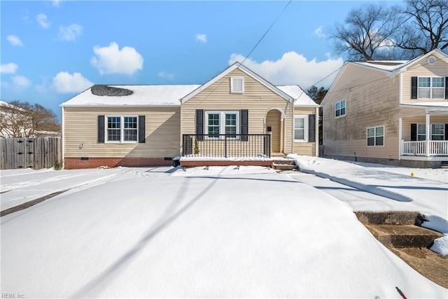 view of front of house featuring crawl space and fence