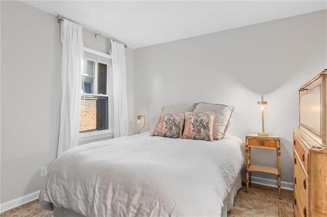 bedroom featuring baseboards