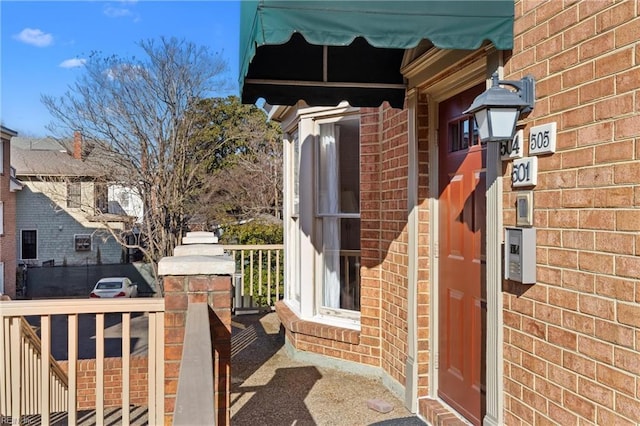 entrance to property with brick siding