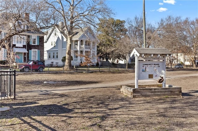 view of yard featuring a residential view and fence