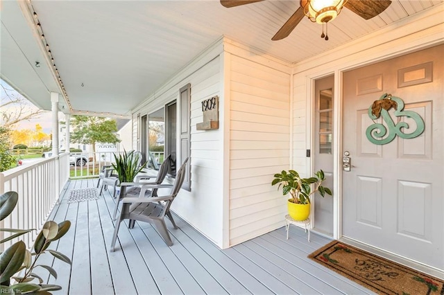 property entrance featuring a porch and ceiling fan