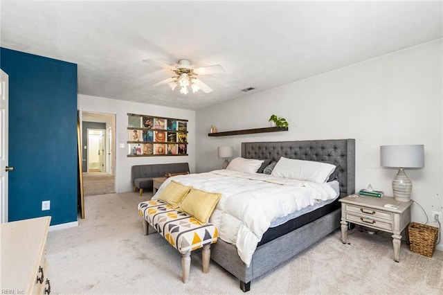 bedroom with carpet floors, ceiling fan, and visible vents