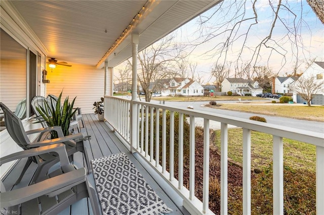 balcony featuring a residential view and covered porch