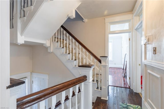 staircase with wood finished floors