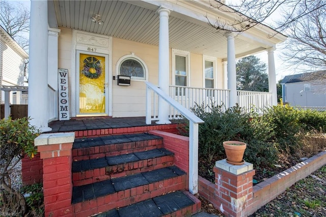 entrance to property with a porch