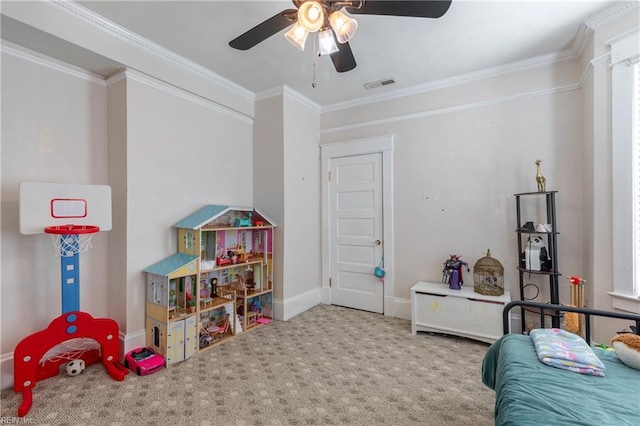 bedroom featuring crown molding, visible vents, carpet flooring, ceiling fan, and baseboards