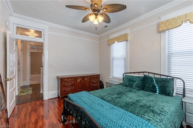 bedroom featuring crown molding, dark wood finished floors, baseboards, and a ceiling fan