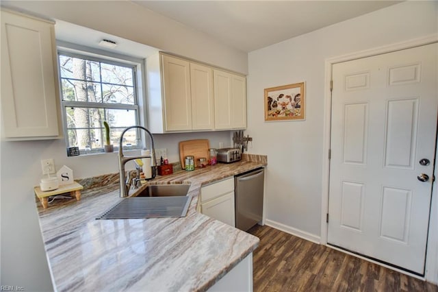 kitchen featuring a sink, baseboards, stainless steel dishwasher, light stone countertops, and dark wood-style floors