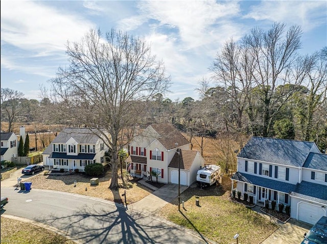 birds eye view of property with a residential view