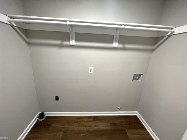 clothes washing area with dark wood-style floors, washer hookup, baseboards, and hookup for an electric dryer