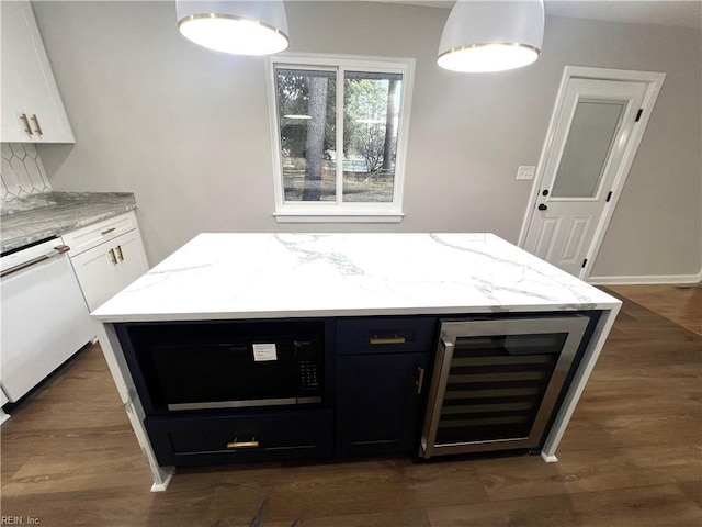 kitchen featuring dark wood-style floors, wine cooler, white dishwasher, light stone countertops, and black microwave