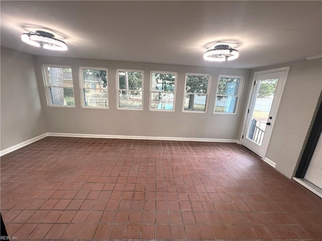 empty room featuring baseboards