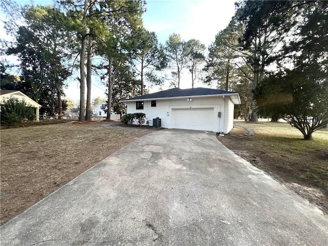 exterior space featuring driveway and cooling unit