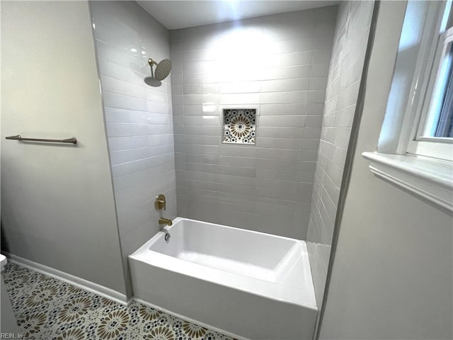 full bath with tile patterned flooring, baseboards, toilet, and shower / bathtub combination