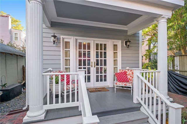 doorway to property with french doors and a porch